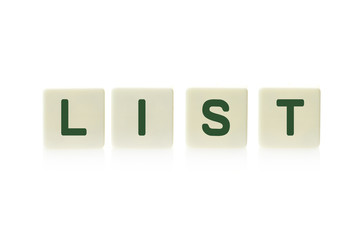 Word "List" on board game square plastic tile pieces, isolated on a white background.