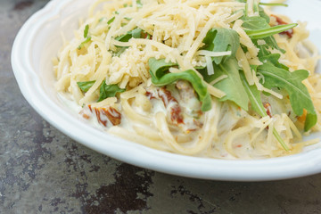 Creamy pasta with sun-dried tomatoes and basil