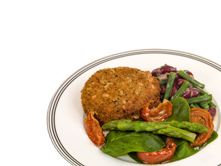 Veggie Burger with Asparagus and Salad Isolated Against a White Background With Copy Space
