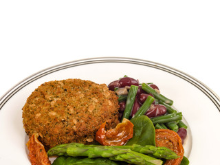 Veggie Burger with Asparagus and Salad Isolated Against a White Background With Copy Space