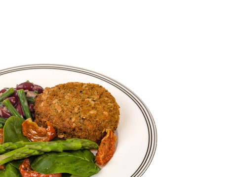 Veggie Burger with Asparagus and Salad Isolated Against a White Background With Copy Space
