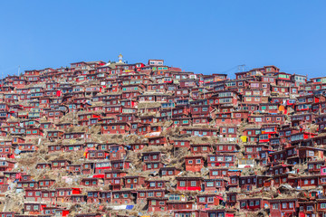 Top view monastery at Larung gar (Buddhist Academy) in sunshine day and background is blue sky, Sichuan, China