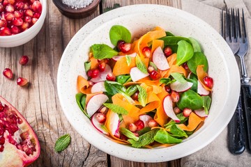 Salad with corn lettuce, radish, carrot, pomegranate and mint