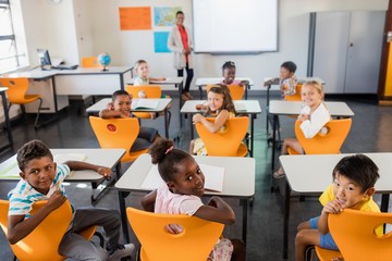 Teacher posing with her students