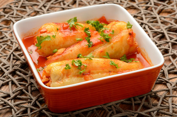 Stuffed peppers baked with tomato sauce.