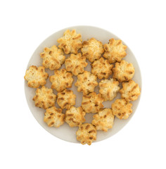 Top view of a plate of sugar free coconut macaroons isolated on a white background.