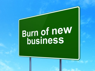 Finance concept: Burn Of new Business on road sign background