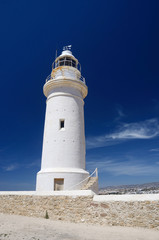 Fototapeta na wymiar Old white lighthouse near the city of New Paphos ,Cyprus,Europe