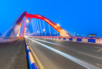Obraz premium traffic trails on bridge,chongqing china.