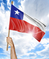 Person's hand holding the Chilean national flag and waving it in the sky, part 3D rendering