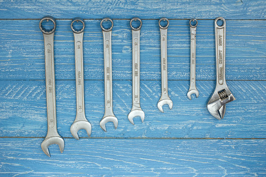 Set Of Wrenches Hanging On A Wooden Board