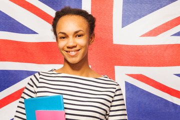 Smiling English student with textbooks