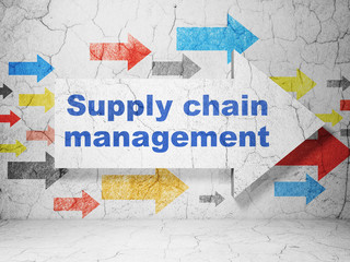 Advertising concept: arrow with Supply Chain Management on grunge wall background