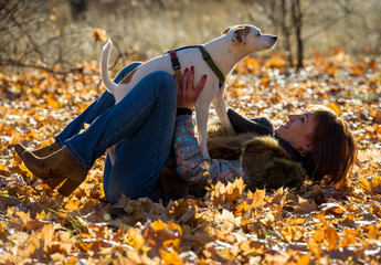 woman with a dog on holiday