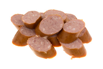 Reduced calorie kielbasa sausage slices isolated on a white background.