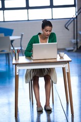 Businesswoman working on his laptop