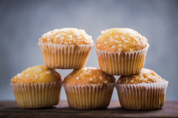 Lemon muffins in row, copy space