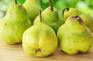 Ripe pears on table