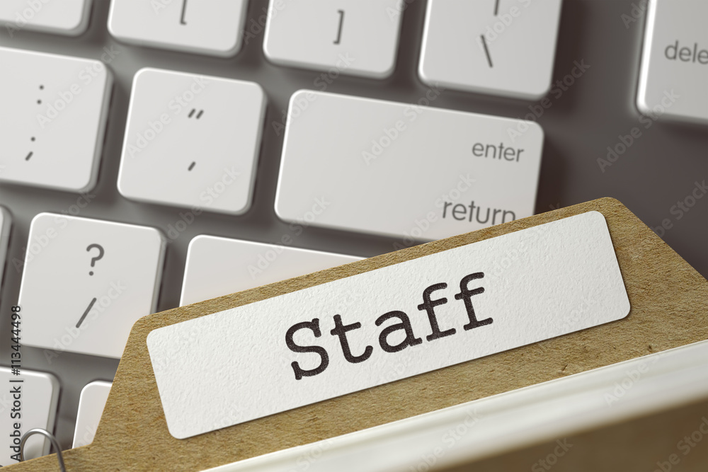 Poster staff written on folder register on background of modern keyboard. business concept. closeup view. t
