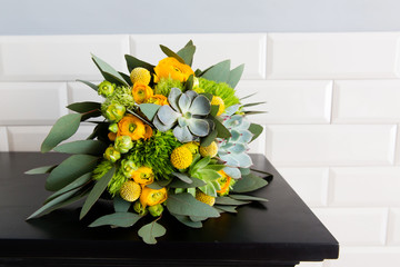 Green and yellow wedding bouquet with succulent 