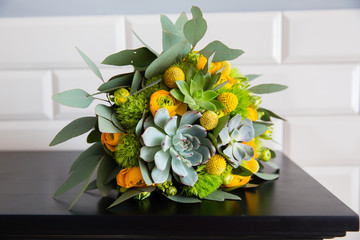 Green and yellow wedding bouquet with succulent 