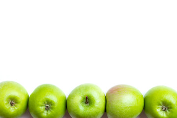 Fototapeta na wymiar green apples in row - isolated