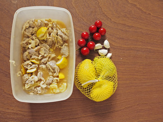 Marinated chicken with lemons garlic and tomato.