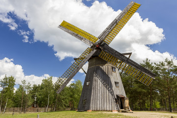 Fototapeta na wymiar An old wooden windmill