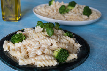 Pasta on plate, blue wooden background