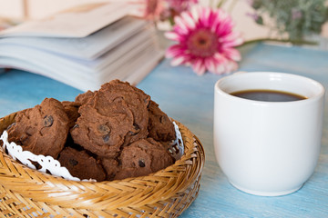 chocolate chip cookies on blue table background