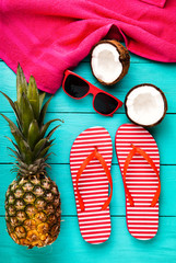 Summer accessories and fruits on wooden floor. Top view and copy space 
