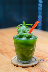 Lime mint smoothie on wooden table