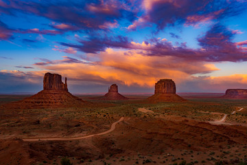 Monument Valley Arizona colorful sunset sky - obrazy, fototapety, plakaty