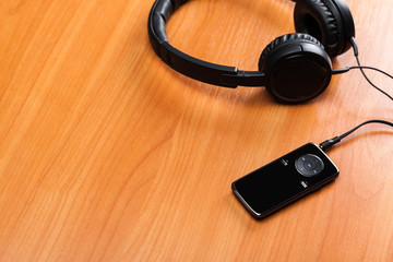 headphones on wooden background