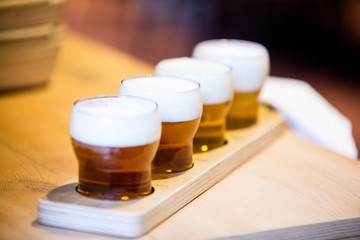 Close-up of beer glasses on the counter