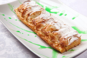 Pie on plate with Green Sauce