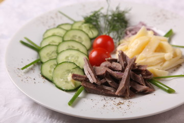meat with potatoes and cucumber