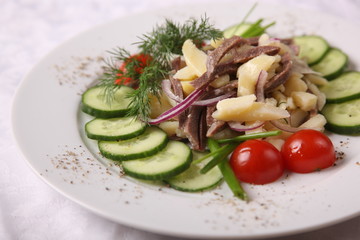 meat with potatoes and cucumber