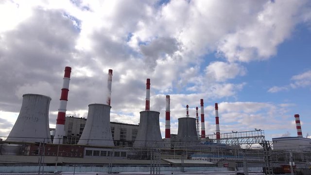 Huge heat electric power plant against beautiful cloudy sky. 4K footage