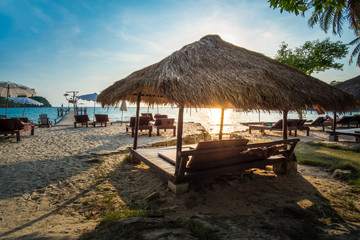 Fototapeta na wymiar Relax pavilion on the sunset tropical beach