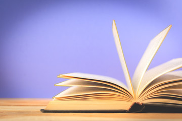 Vintage old books on wooden deck table