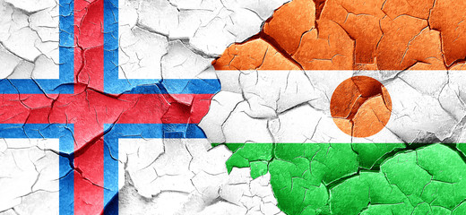 faroe islands flag with Niger flag on a grunge cracked wall