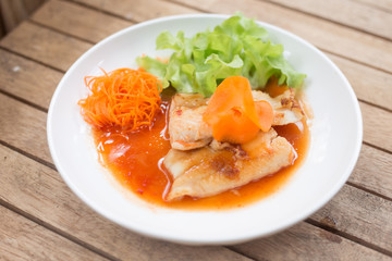 Fish steaks on a white plate