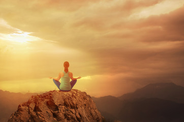 Woman doing yoga against Landscape