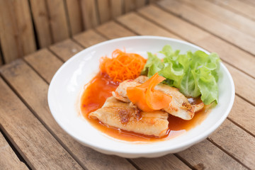 Fish steaks on a white plate