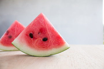 Slices of watermelon on wooden desk background