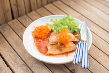 Fish steaks on a white plate
