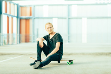 Portrait of Young Long Haired Man with Longboard