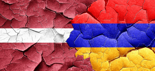 Latvia flag with Armenia flag on a grunge cracked wall