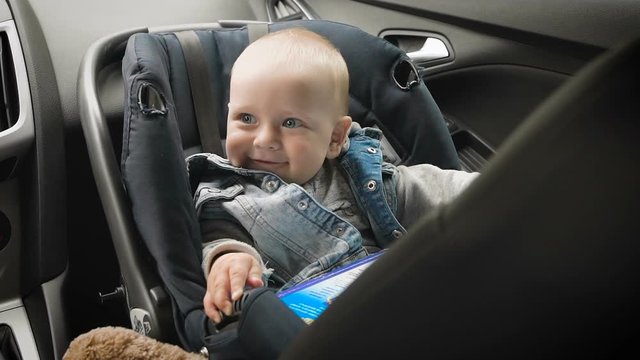 In car safety for children. Little boy sitting in a special car seat